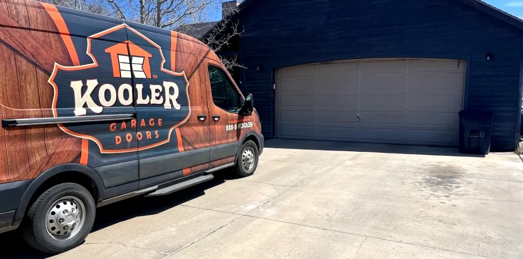 Kooler Garage Door company van parked in front of a garage door in Grand Junction. Has recently performed garage door repair services